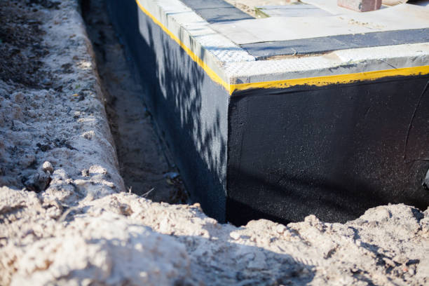 Professional Waterproofing technician working in Mound, MN